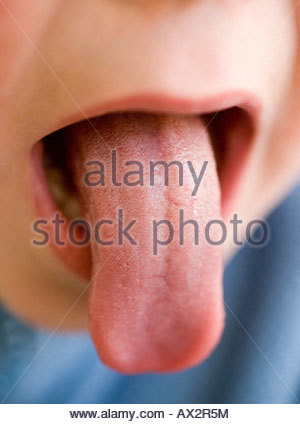 close-up of a young boy sticking his tongue out Stock Photo: 26358699 ...