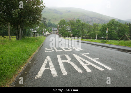 A road sign in Welsh and English in the village of Llangynog in Powys Wales Stock Photo