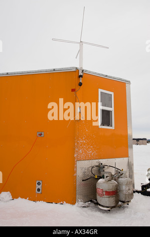 AN ICE FISHING HOUSE EQUIPED WITH A TV SATELITE ON LEECH LAKE MINNESOTA ...