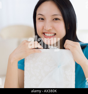 Asian woman holding gift Stock Photo