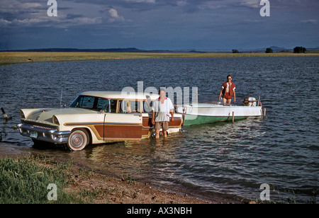 Ford Mercury station wagon and trailer with boat at a Californian lake c. 1958 Stock Photo