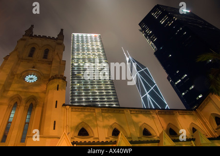 China, Hong Kong. St John's Cathedral contrasting with modern skyscrapers. Stock Photo