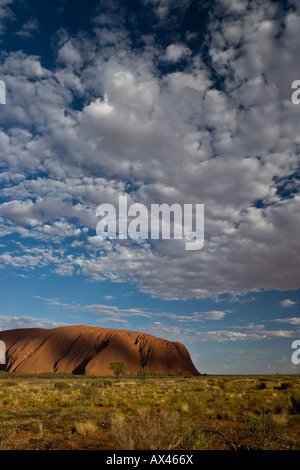 Dramatic light and shadow over Uluru (Ayres Rock) in the Australian Outback Stock Photo