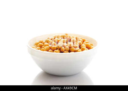 Dried yellow split peas in bowl Stock Photo