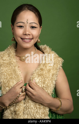 Portrait of an adult woman wearing a stole of fur and smiling Stock Photo