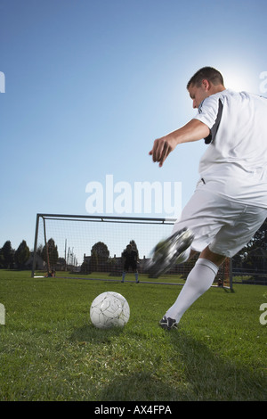 Man Playing Soccer Stock Photo