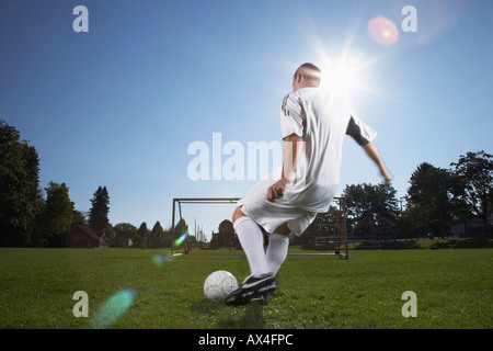 Man Playing Soccer Stock Photo