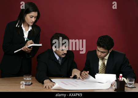 Three business people working in an office Stock Photo