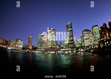 Colorful night time graphic sunset of Sydney Skyline from Circular Quay in New South Wales Australia Stock Photo