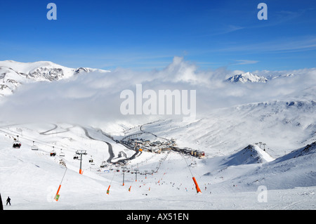 A broad view from the ski slope on to the popular Pas de la Casa skiing resort in the Pyrenees, Andorra (Spain) Stock Photo