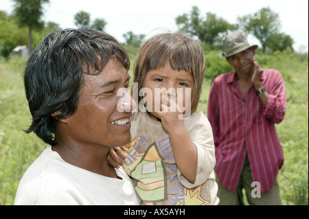 Father with child on his arms, Nivaclé Indians, Jothoisha, Chaco, Paraguay, South America Stock Photo