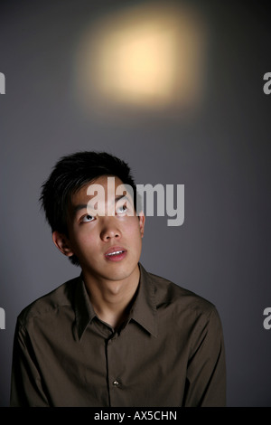 Young man looking up Stock Photo