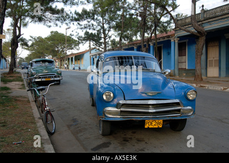 Blue vintage car driving down a street in Vinales, Cuba, Caribbean Stock Photo