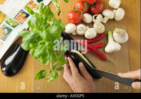 Man cutting vegetables, elevated view Stock Photo