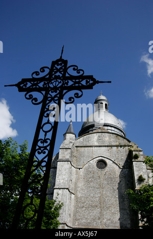 Saint Quiriace Collegiate church with a iron cross in foreground. Provins France Stock Photo