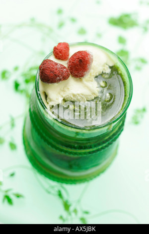 Vanilla icecream with strawberries and sweet pesto made with chervil, pumpkin seeds and honey Stock Photo