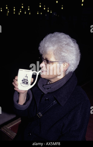 Karlovy Vary (Carlsbad), Czech Republic. Woman taking the waters at the spa baths. Stock Photo