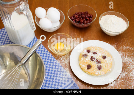 Cherry pancakes and ingredients Stock Photo