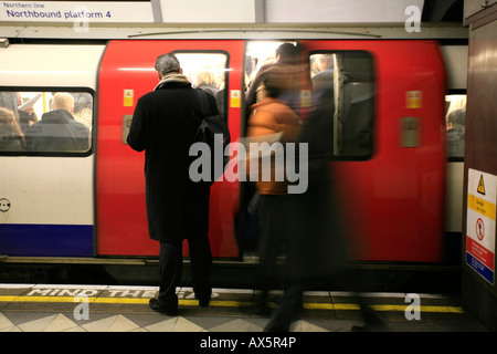 Passengers boarding a train during rush hour at Bank / Monument underground station, London, England, UK, Europe Stock Photo