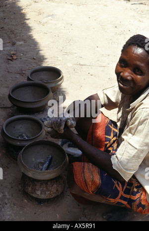 Kirambo, Tanzania. Woman making pots for domestic use. Stock Photo