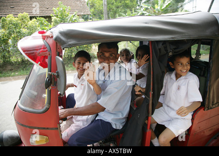 Children dressed in school uniforms, passengers in a tuk-tuk, Godagama, Sri Lanka, Asia