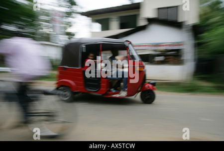 Tuk-tuk driving through Hanwella, Sri Lanka, South Asia