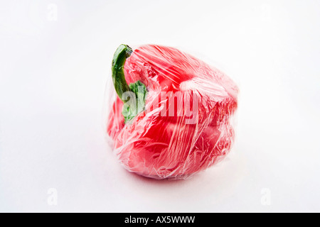 Red pepper wrapped in plastic Stock Photo
