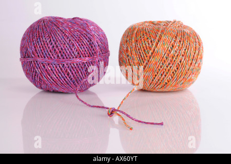 Two balls of cord used for recycling tied together Stock Photo