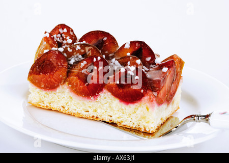 Plum cake on plate Stock Photo