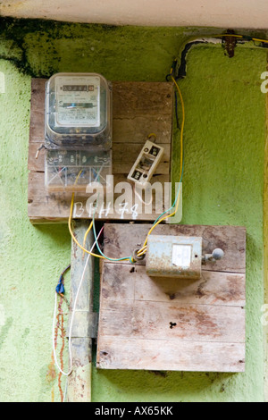 Dangerous looking electrical wiring junction box on wall of Indian house Stock Photo