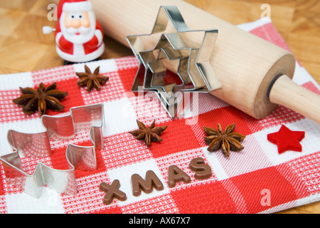 Cookie cutters and rolling pin, close-up, elevated view Stock Photo