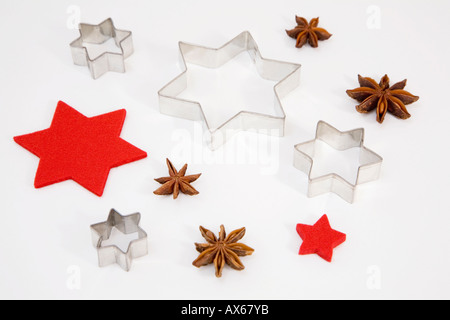 Star-shapeed cookie cutters, star-anise and felt stars Stock Photo