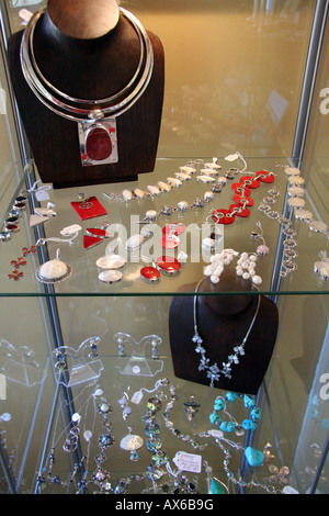 Craft jewellery in a shop display case Stock Photo