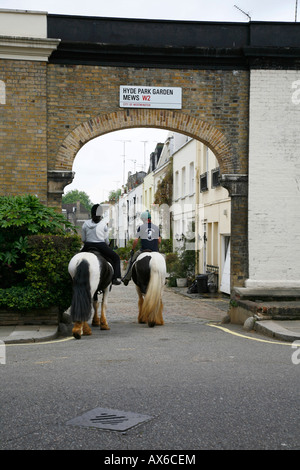 Horse riders entering Hyde Park Gardens Mews, Bayswater, London Stock Photo