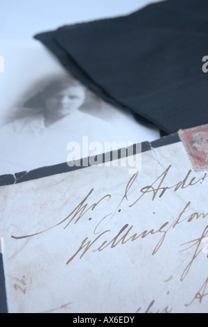 Closeup of Black edged victorian letter announcing death with accompanying black and white photo Stock Photo
