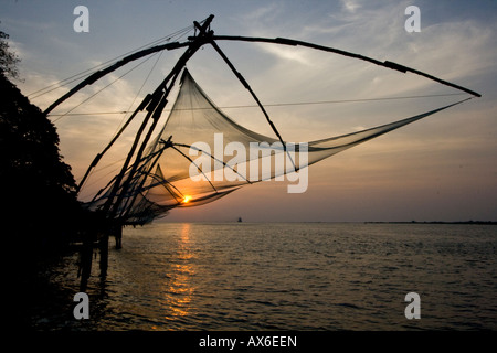 Chinese Fishing Nets at Sunset in Cochin India Stock Photo