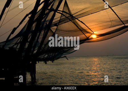 Chinese Fishing Nets at Sunset in Cochin India Stock Photo