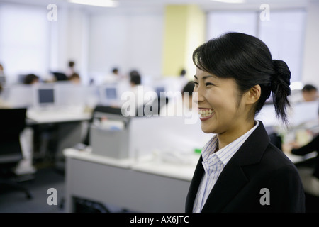 A ecstatic view of woman in the office Stock Photo