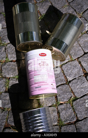 close up of empty tin cans behind a car after marriage-ceremony in church. germany, europe Stock Photo