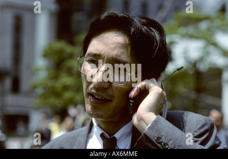 Business man on mobile Tokyo Japan Stock Photo