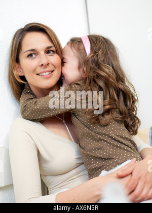 Close-up of girl hugging her mother Stock Photo