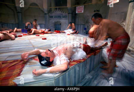 Men laying and getting soaped in Turkish Bath Istanbul Turkey Stock Photo