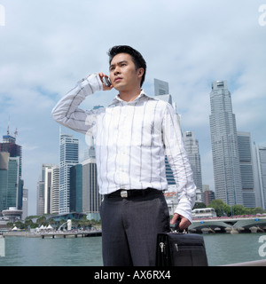 Low angle view of a businessman talking on a mobile phone Stock Photo