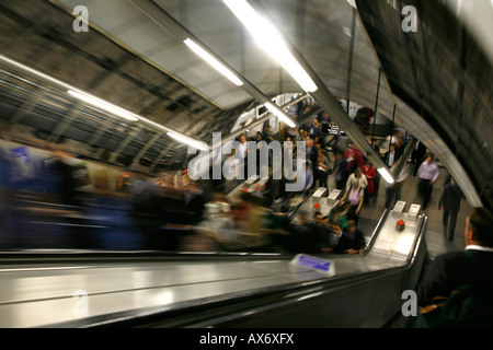 Commuters travelling up the escalators at Holborn tube station, London Stock Photo