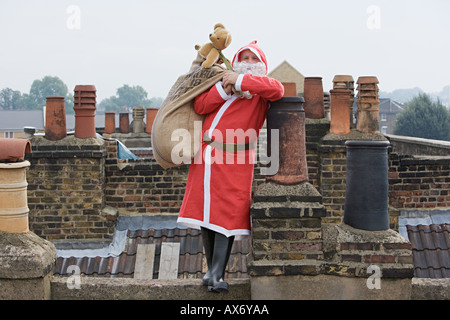 Santa claus delivering gifts Stock Photo