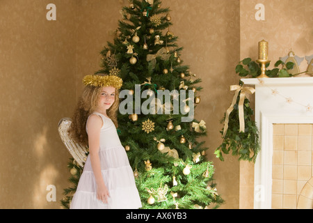 Girl dressed as an angel at christmas Stock Photo