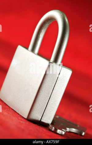 close up of closed metal padlock and key Stock Photo