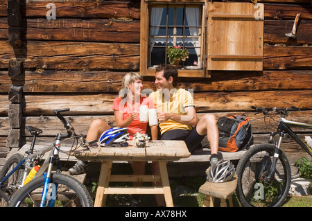 Austria, Salzburger Land, Young couple toasting Stock Photo