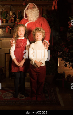 Santa claus with two children Stock Photo