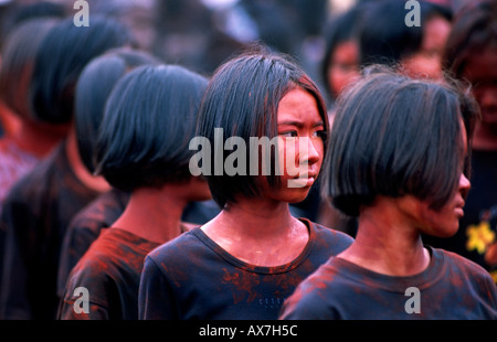 Thai girls smeared in mud during the Phi Ta Kon festival. Dansai, Thailand. Stock Photo